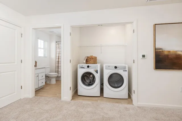 a spacious bedroom with a bed and a sink