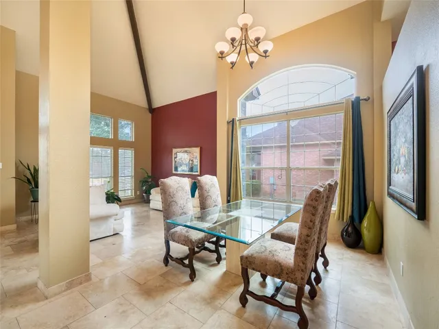 a living room with furniture a fireplace and a table