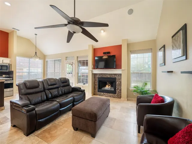 a living room with furniture and a fireplace