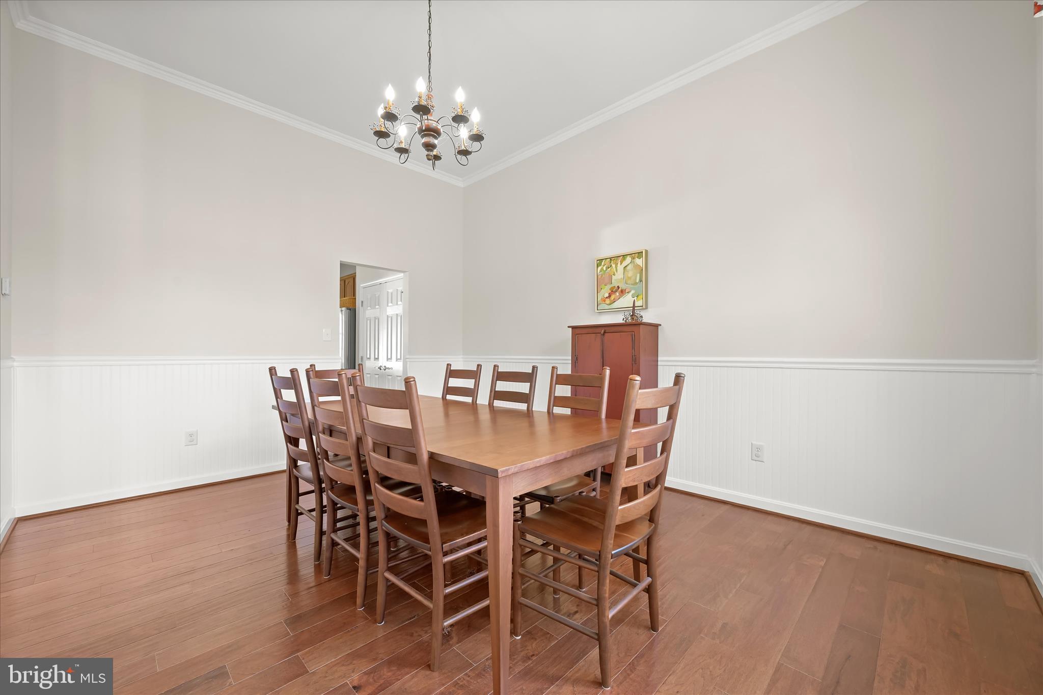 6735 Mink Hollow Road Highland, MD 20777 - Photo 11 of 58 a view of a dining room with furniture and chandelier