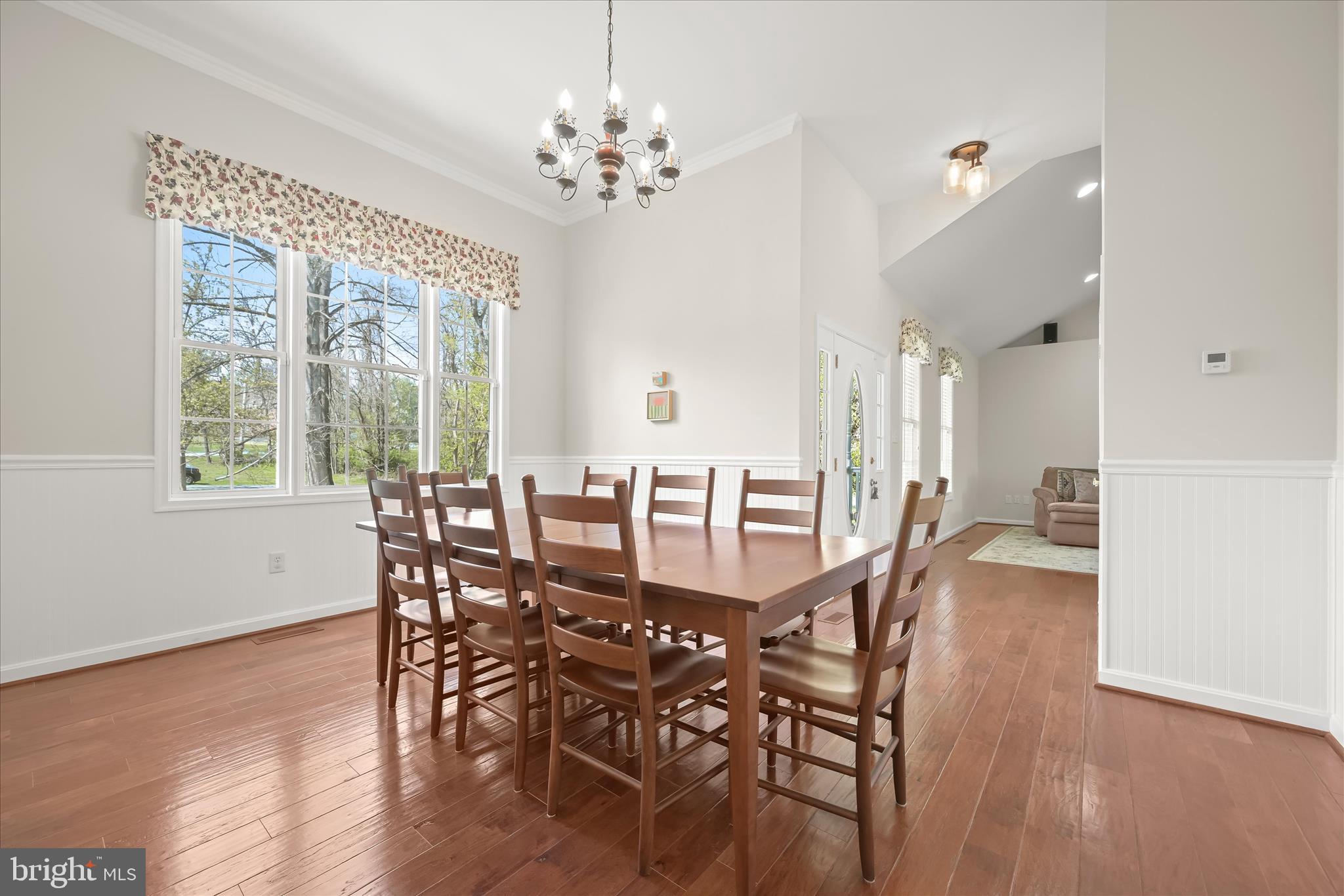 6735 Mink Hollow Road Highland, MD 20777 - Photo 12 of 58 a view of a dining room with furniture window and wooden floor