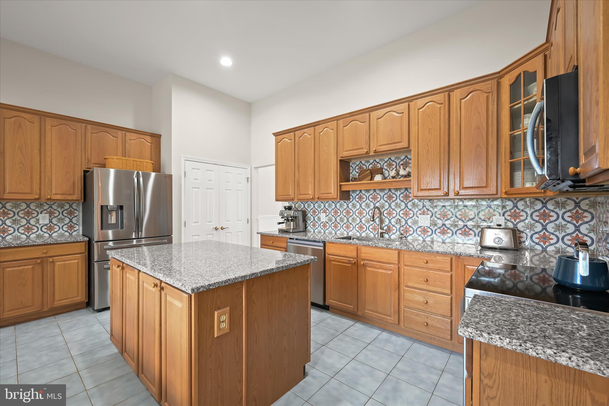 6735 Mink Hollow Road Highland, MD 20777 - Photo 15 of 58 a kitchen with stainless steel appliances granite countertop a sink stove refrigerator and cabinets