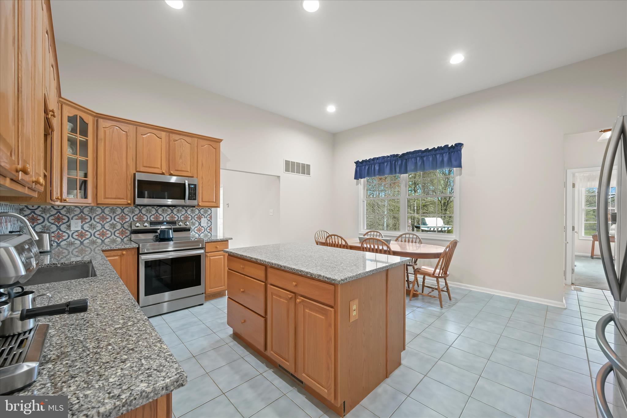 6735 Mink Hollow Road Highland, MD 20777 - Photo 16 of 58 a kitchen with a stove a sink and a refrigerator