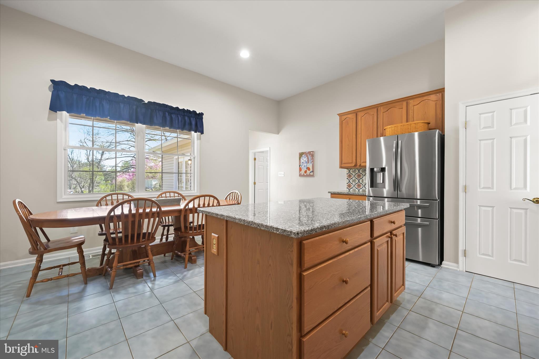 6735 Mink Hollow Road Highland, MD 20777 - Photo 18 of 58 a dining hall with stainless steel appliances granite countertop a table and chairs