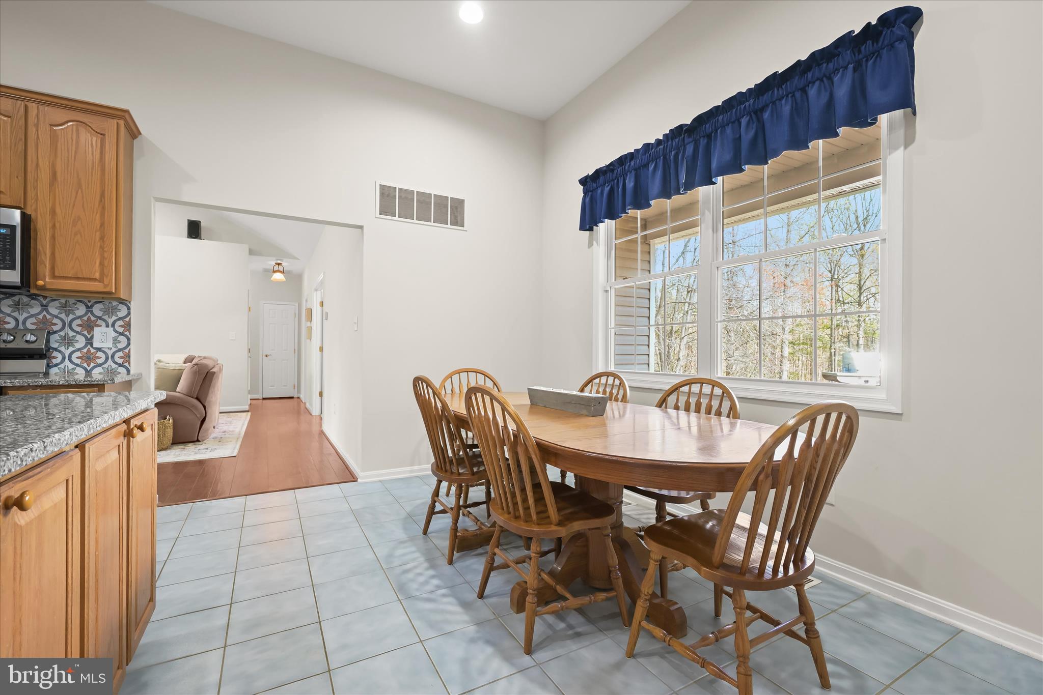 6735 Mink Hollow Road Highland, MD 20777 - Photo 20 of 58 a view of a dining room with furniture and a large window