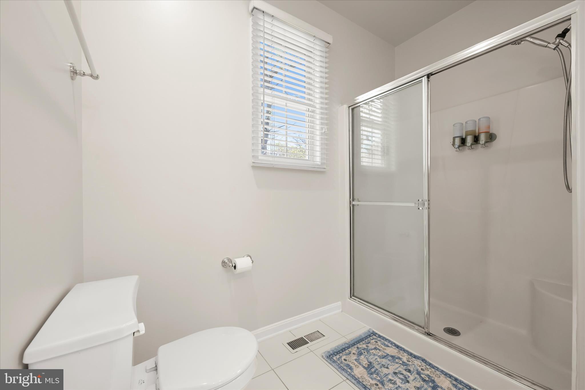 6735 Mink Hollow Road Highland, MD 20777 - Photo 26 of 58 a bathroom with a toilet and a shower