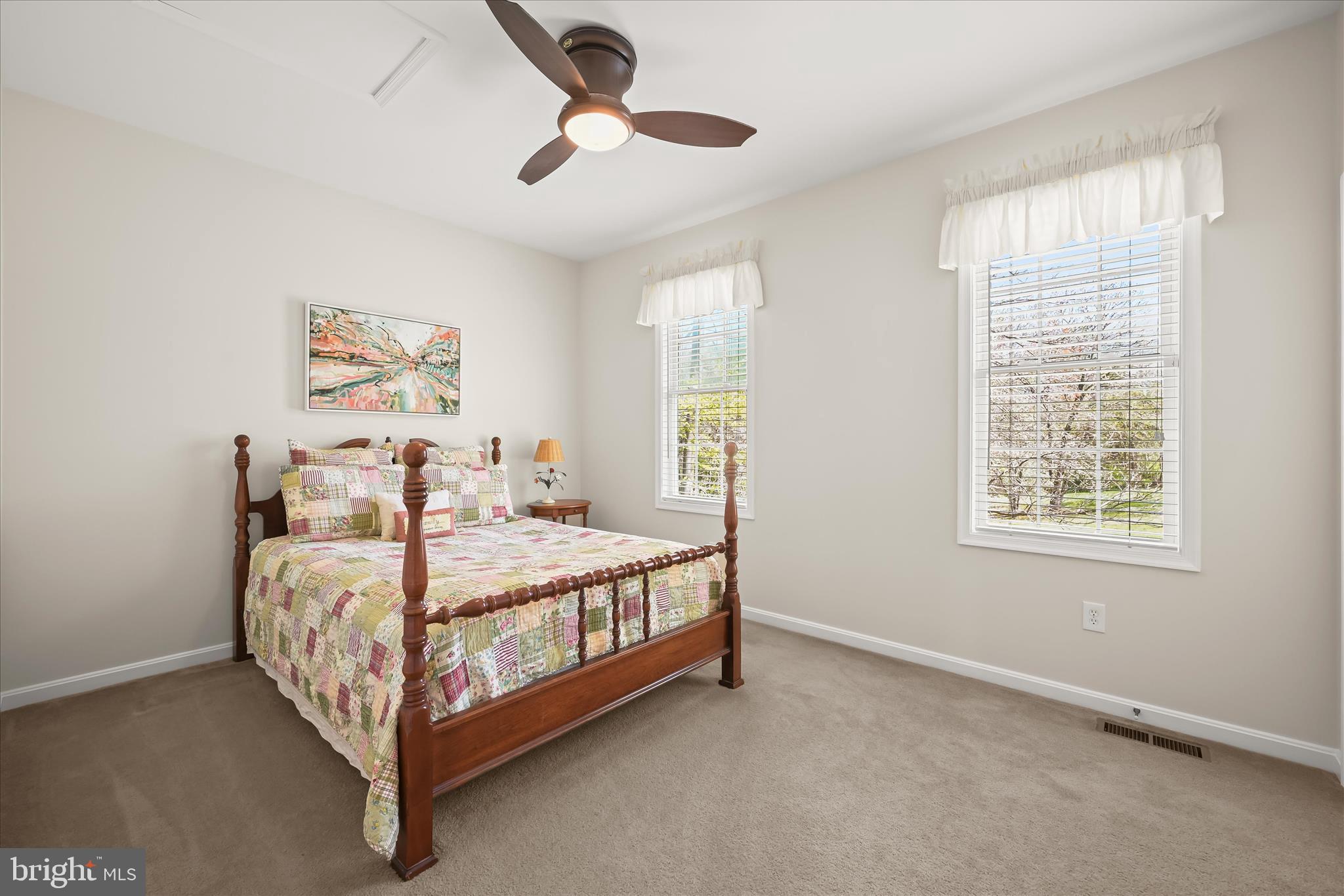 6735 Mink Hollow Road Highland, MD 20777 - Photo 28 of 58 a bed sitting in a bedroom next to a window