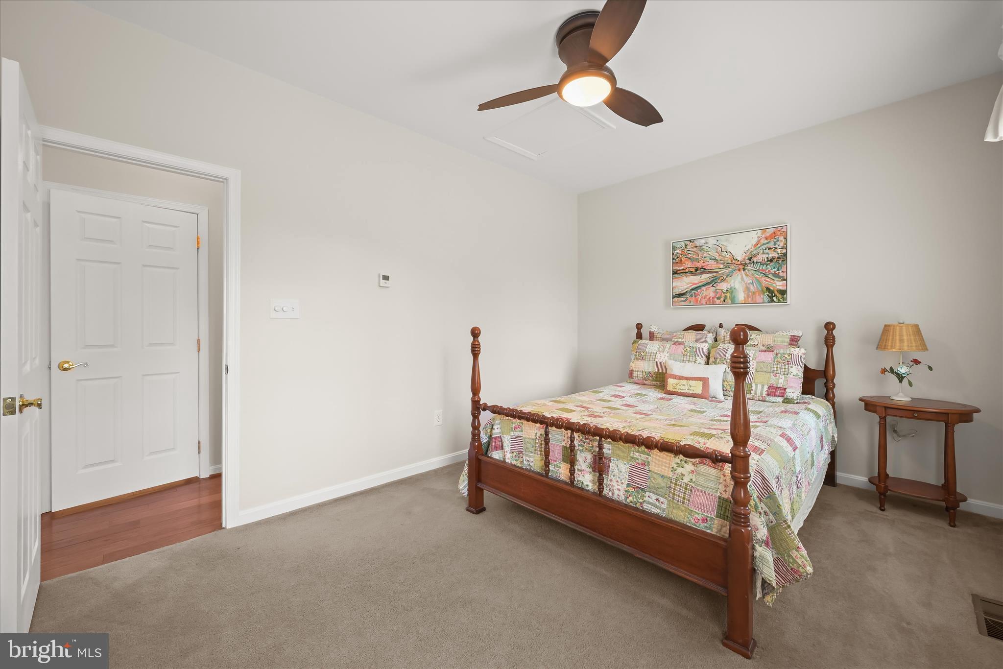 6735 Mink Hollow Road Highland, MD 20777 - Photo 29 of 58 a bed room with a bed and a chandelier