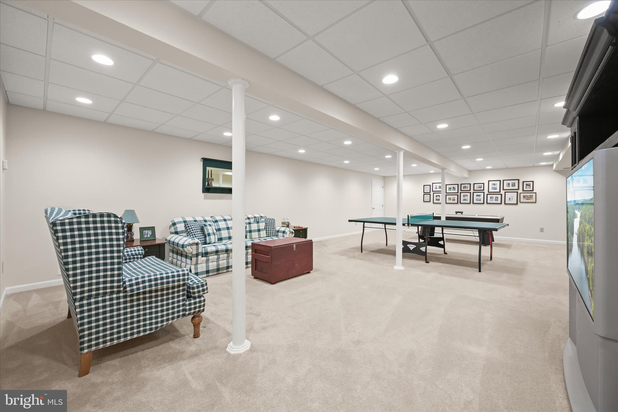 6735 Mink Hollow Road Highland, MD 20777 - Photo 37 of 58 a living room with furniture and a flat screen tv