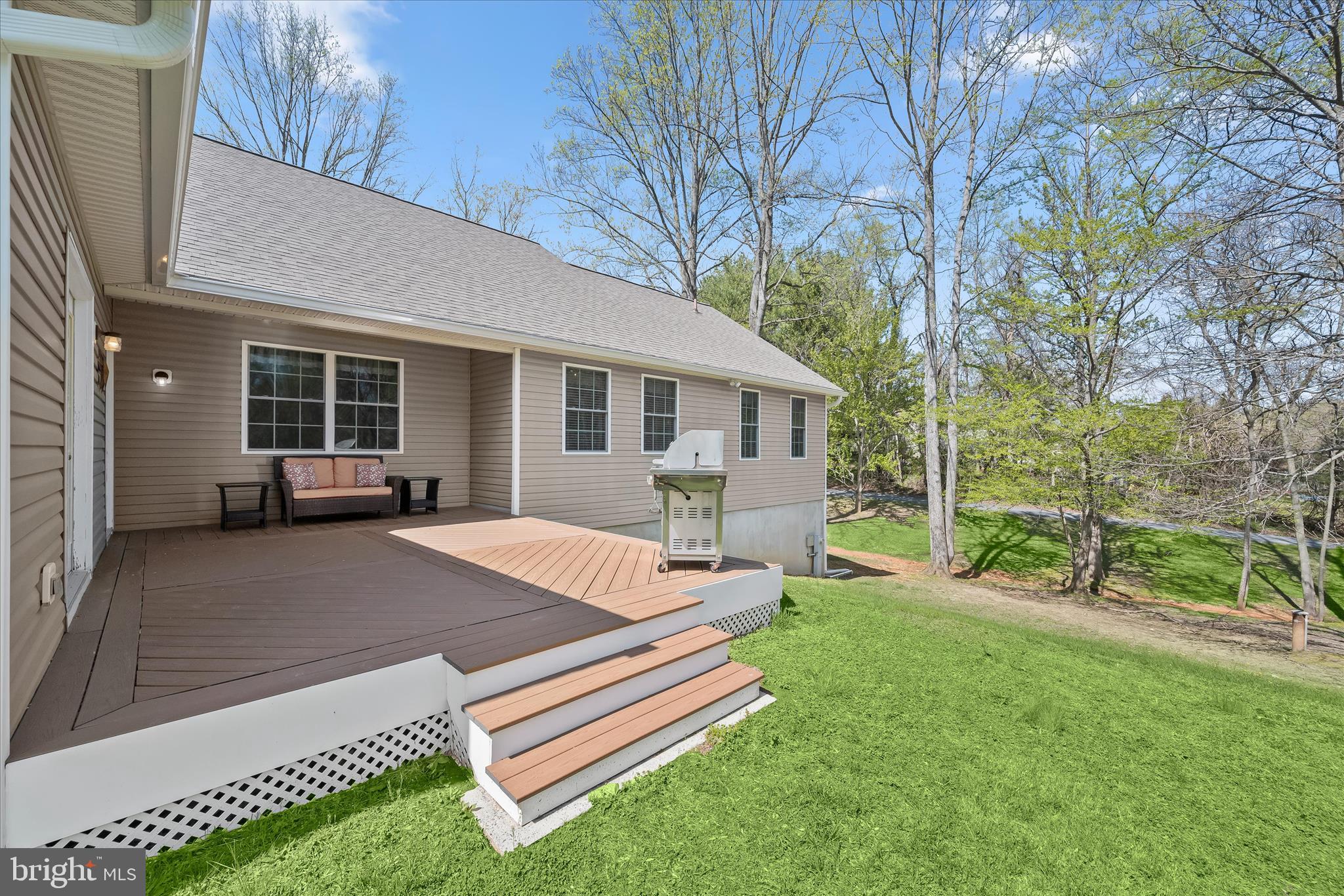 6735 Mink Hollow Road Highland, MD 20777 - Photo 41 of 58 a view of a house with backyard and sitting area