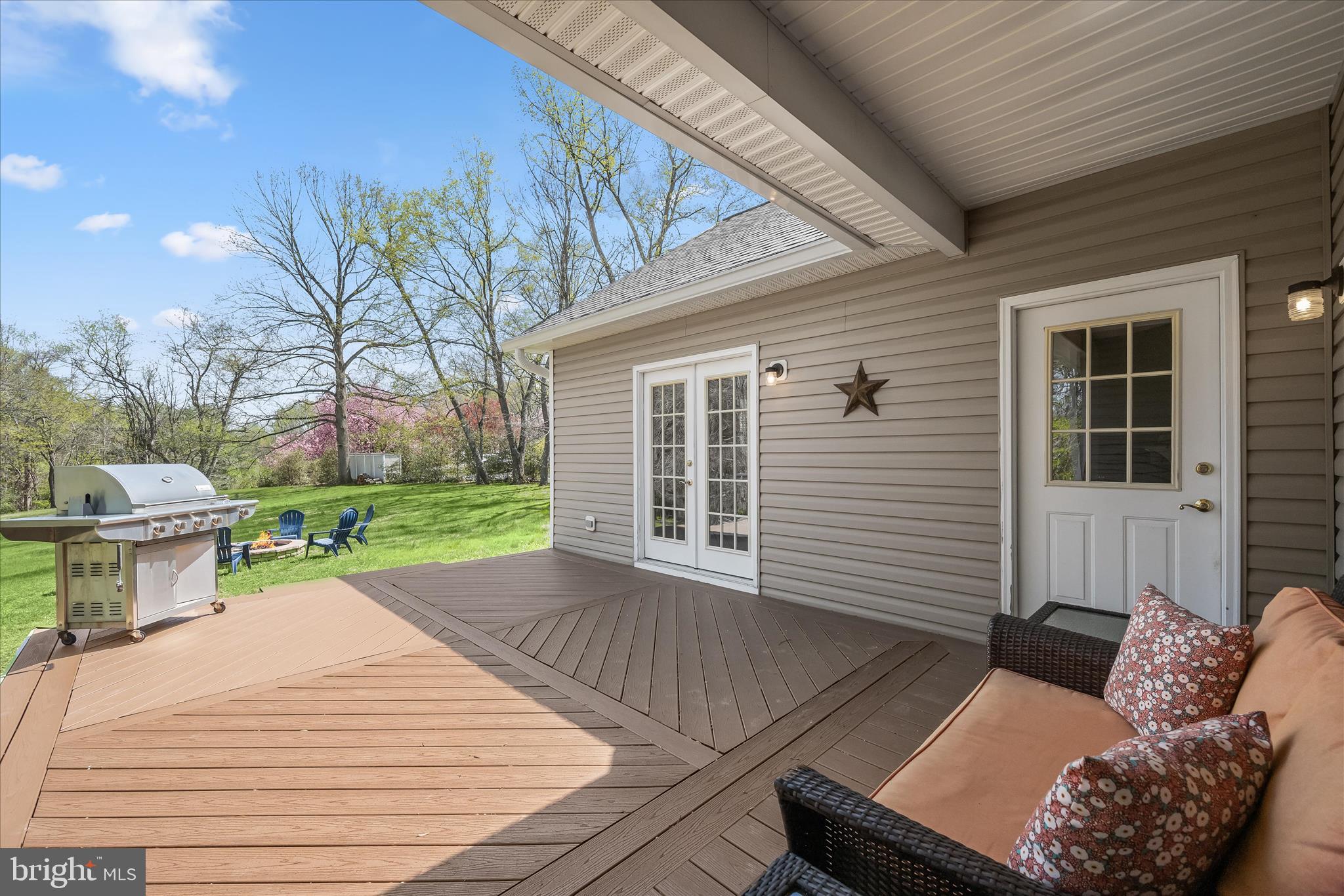 6735 Mink Hollow Road Highland, MD 20777 - Photo 43 of 58 a view of a patio with couches chairs and potted plants