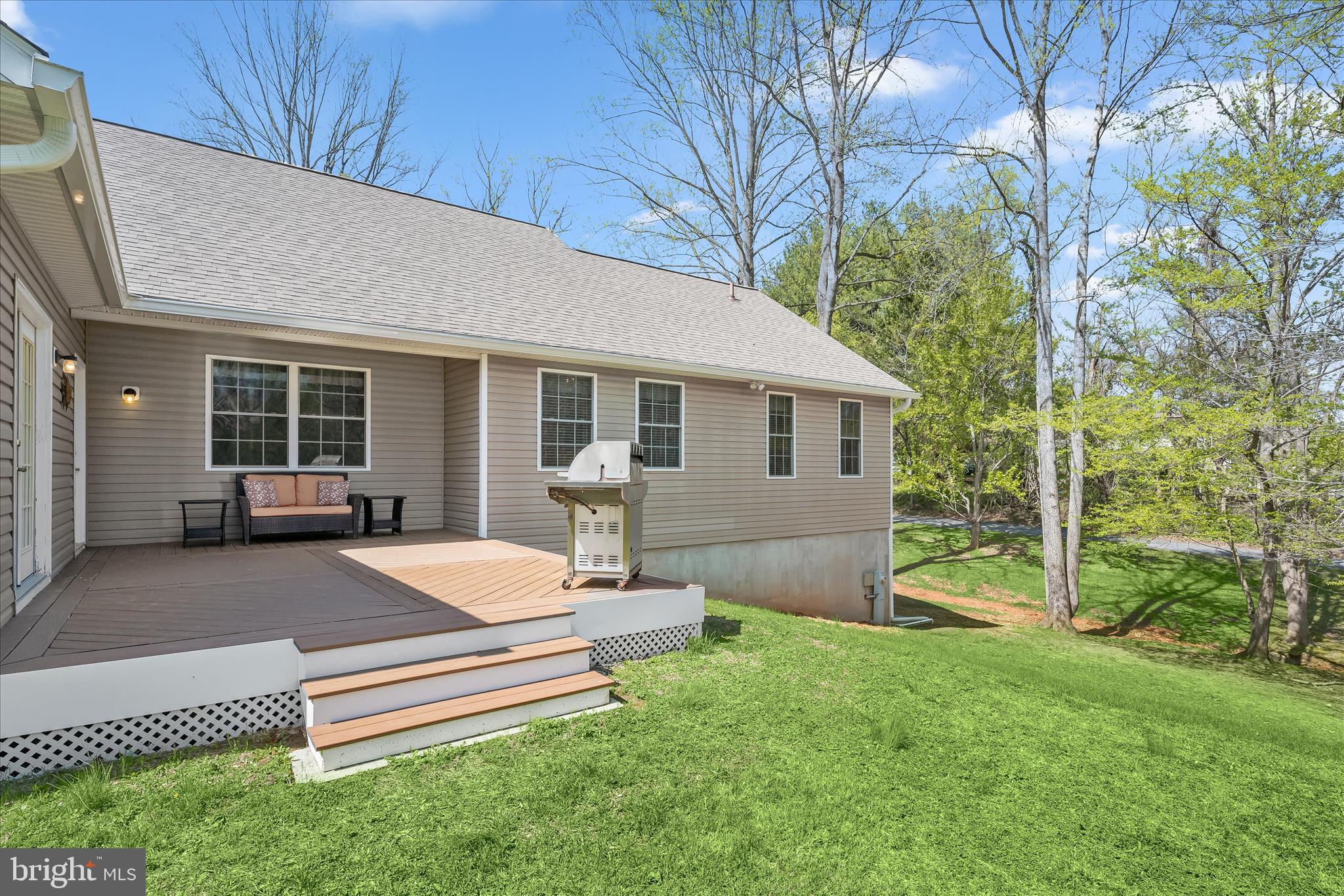 6735 Mink Hollow Road Highland, MD 20777 - Photo 44 of 58 a view of a house with backyard and sitting area