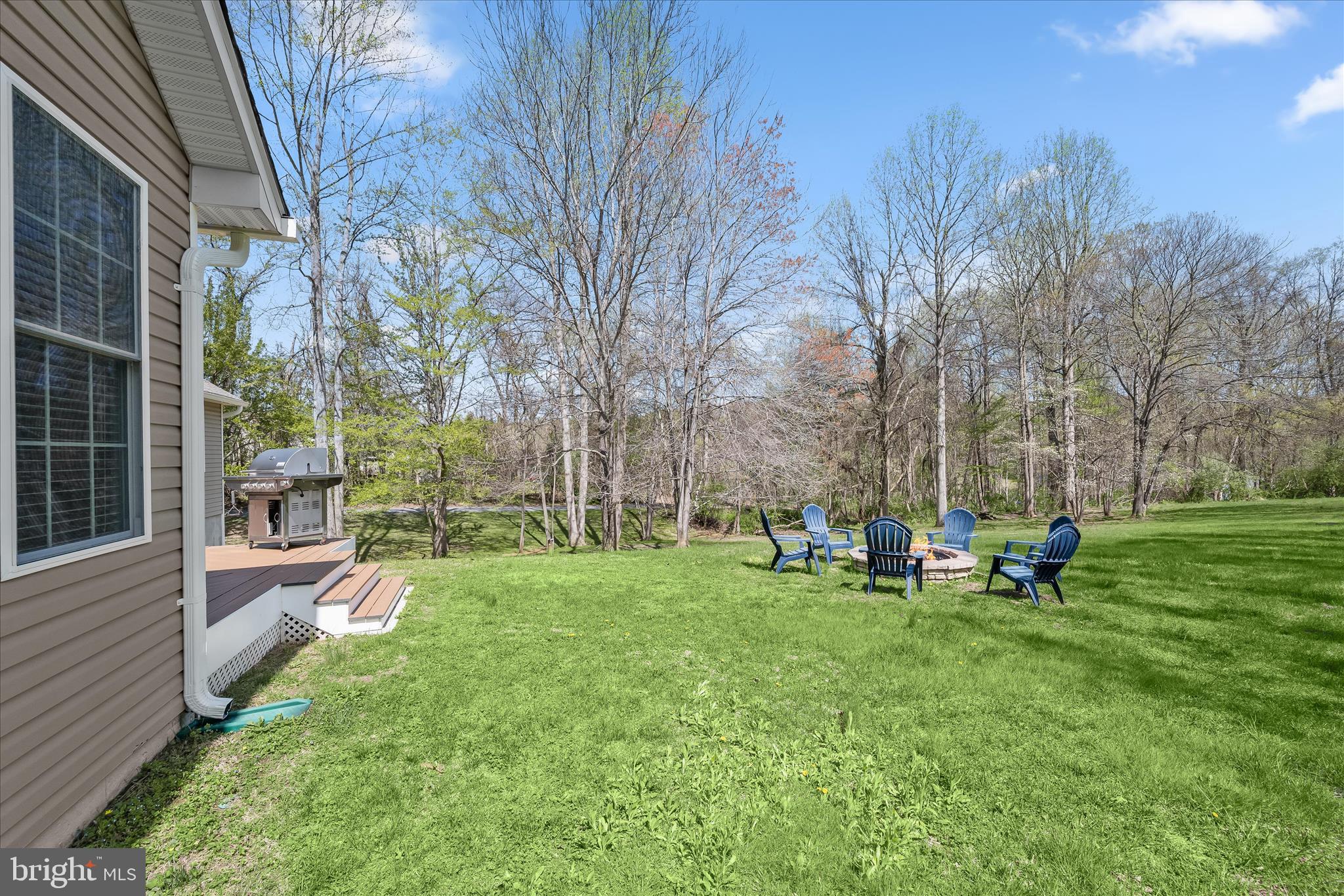 6735 Mink Hollow Road Highland, MD 20777 - Photo 46 of 58 a view of a house with a backyard and sitting area