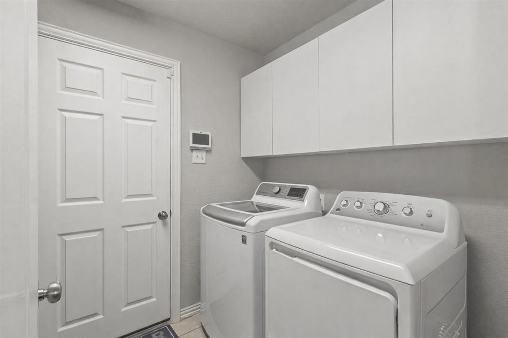 1906 Armstrong Drive Allen, TX 75002 - Photo 13 of 39 a utility room with dryer and washer
