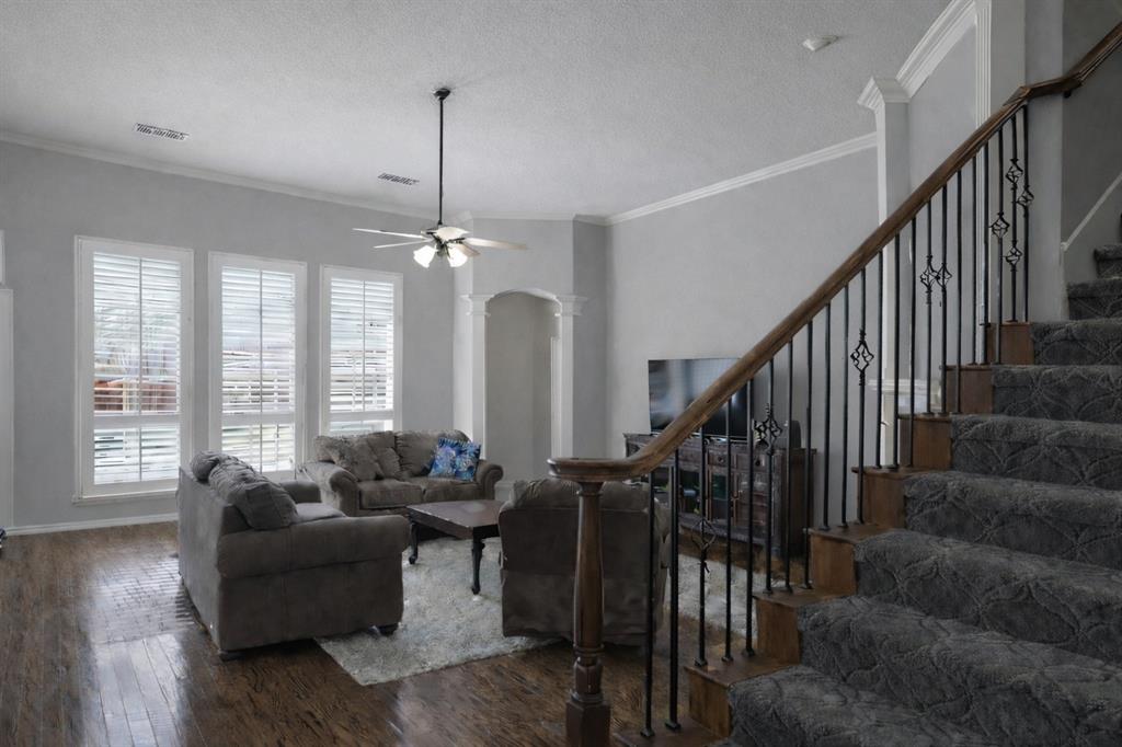 1906 Armstrong Drive Allen, TX 75002 - Photo 14 of 39 a living room with furniture and a chandelier