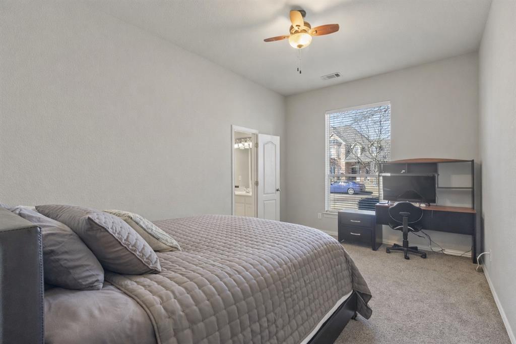 1906 Armstrong Drive Allen, TX 75002 - Photo 29 of 39 a bedroom with a bed and a chair