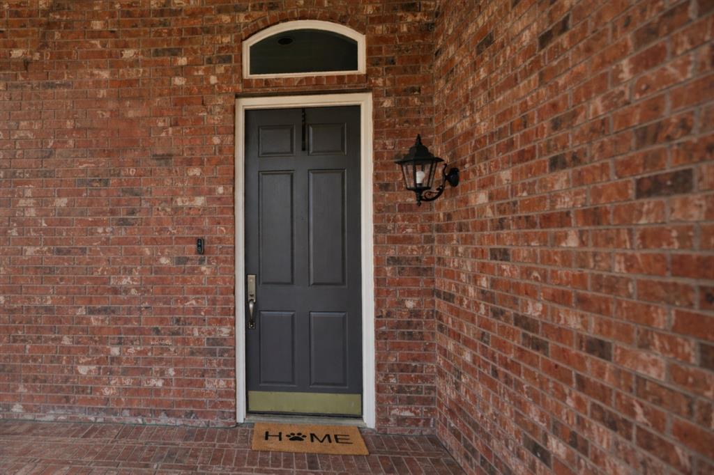 1906 Armstrong Drive Allen, TX 75002 - Photo 7 of 39 a front view of a brick wall