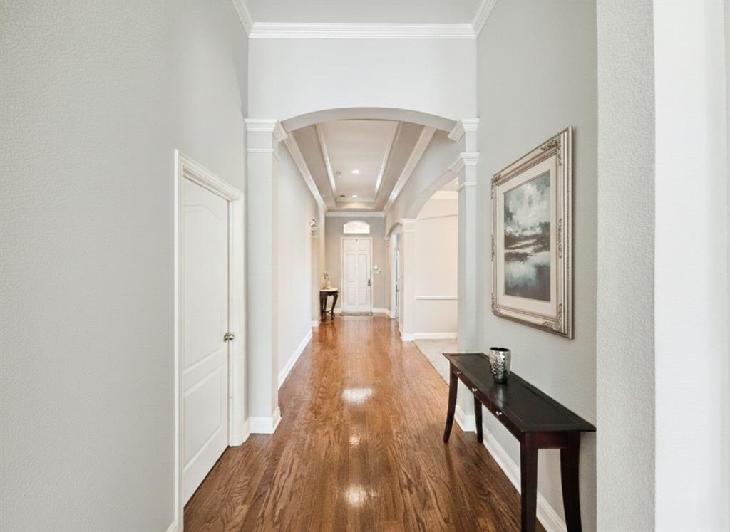 1906 Armstrong Drive Allen, TX 75002 - Photo 9 of 39 a view of a hallway with wooden floor and furniture