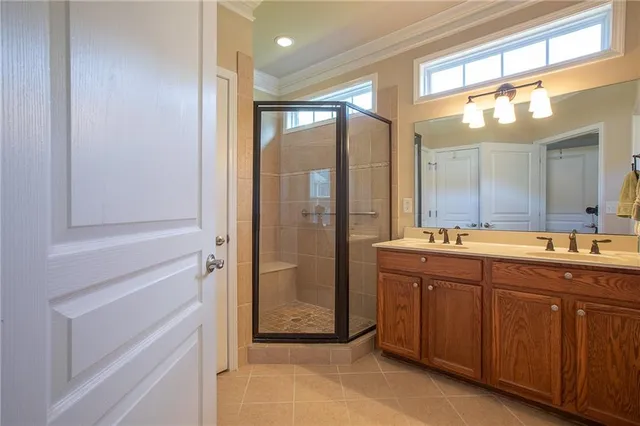 a bathroom with a double vanity sink and mirror