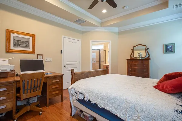 a bedroom with a bed and a desk