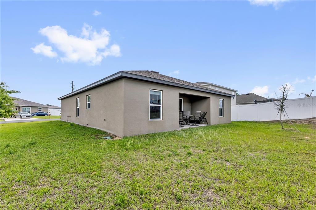 2134 Rio Grande Canyon Loop Poinciana, FL 34759 - Photo 19 of 22 a view of a backyard of the house