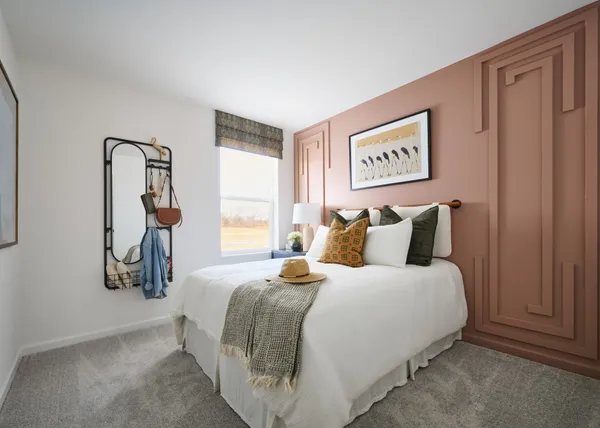 a bedroom with bed and window