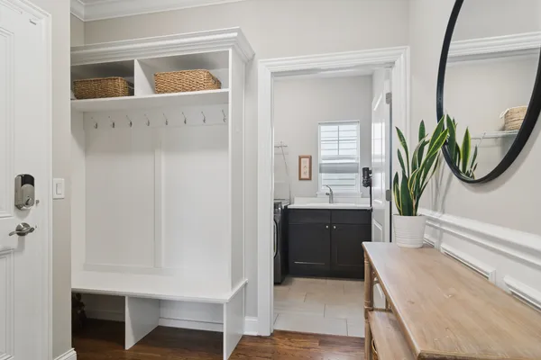a bathroom with a tub sink and mirror