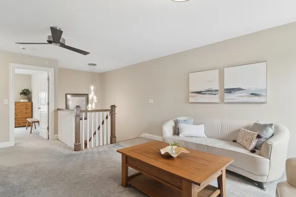 a living room with furniture and a table