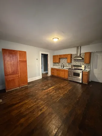 a view of a kitchen with a sink cabinets and a window