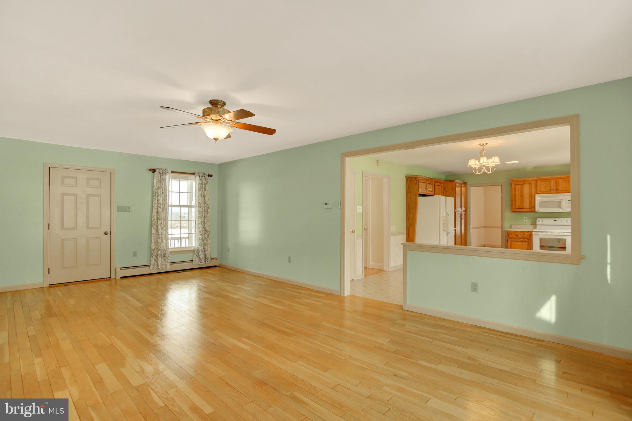 202 South Ridge Road Boiling Springs, PA 17007 - Photo 13 of 36 a view of an empty room with window and wooden floor