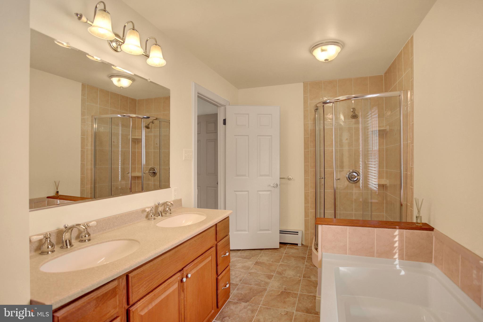 202 South Ridge Road Boiling Springs, PA 17007 - Photo 22 of 36 a bathroom with a double vanity sink mirror and shower