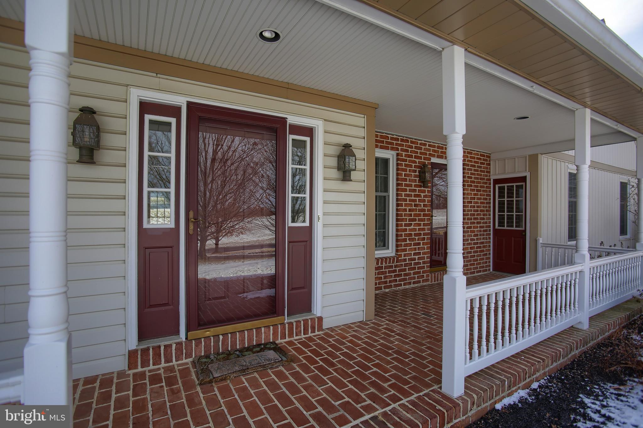 202 South Ridge Road Boiling Springs, PA 17007 - Photo 5 of 36 a view of a porch with a door and wooden floor