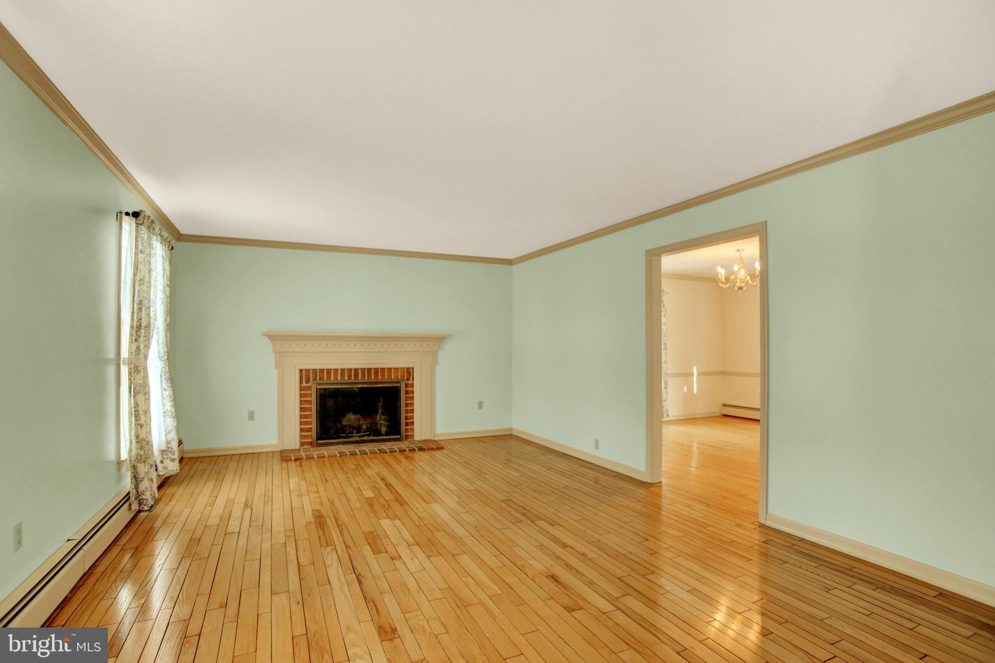 202 South Ridge Road Boiling Springs, PA 17007 - Photo 6 of 36 wooden floor fireplace and natural light in room