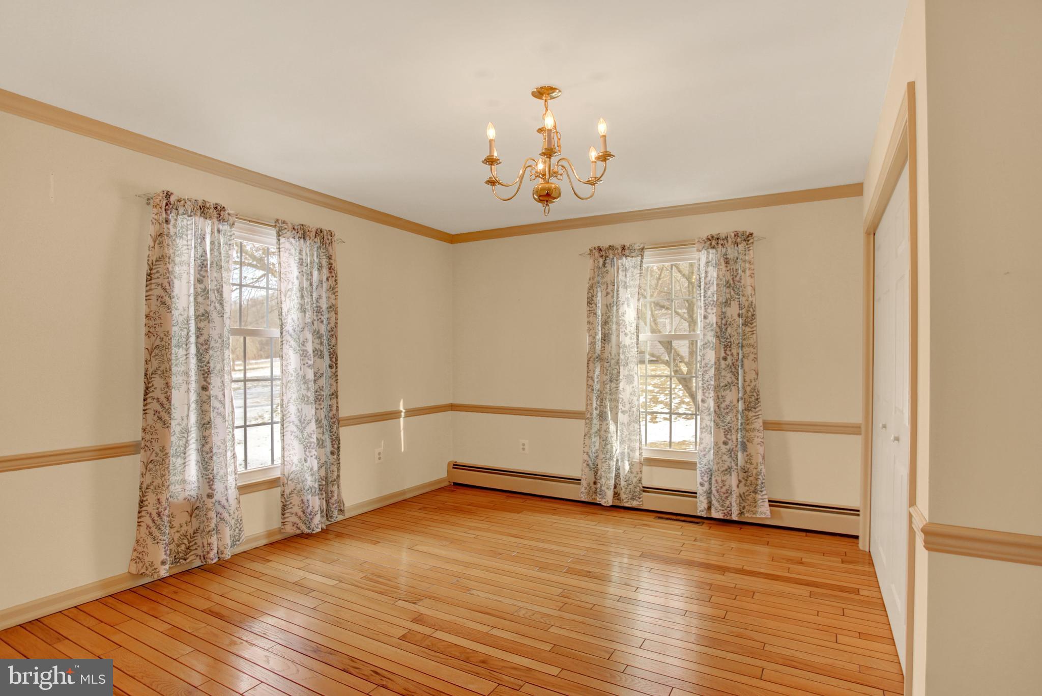 202 South Ridge Road Boiling Springs, PA 17007 - Photo 8 of 36 a view of an empty room with a window and wooden floor