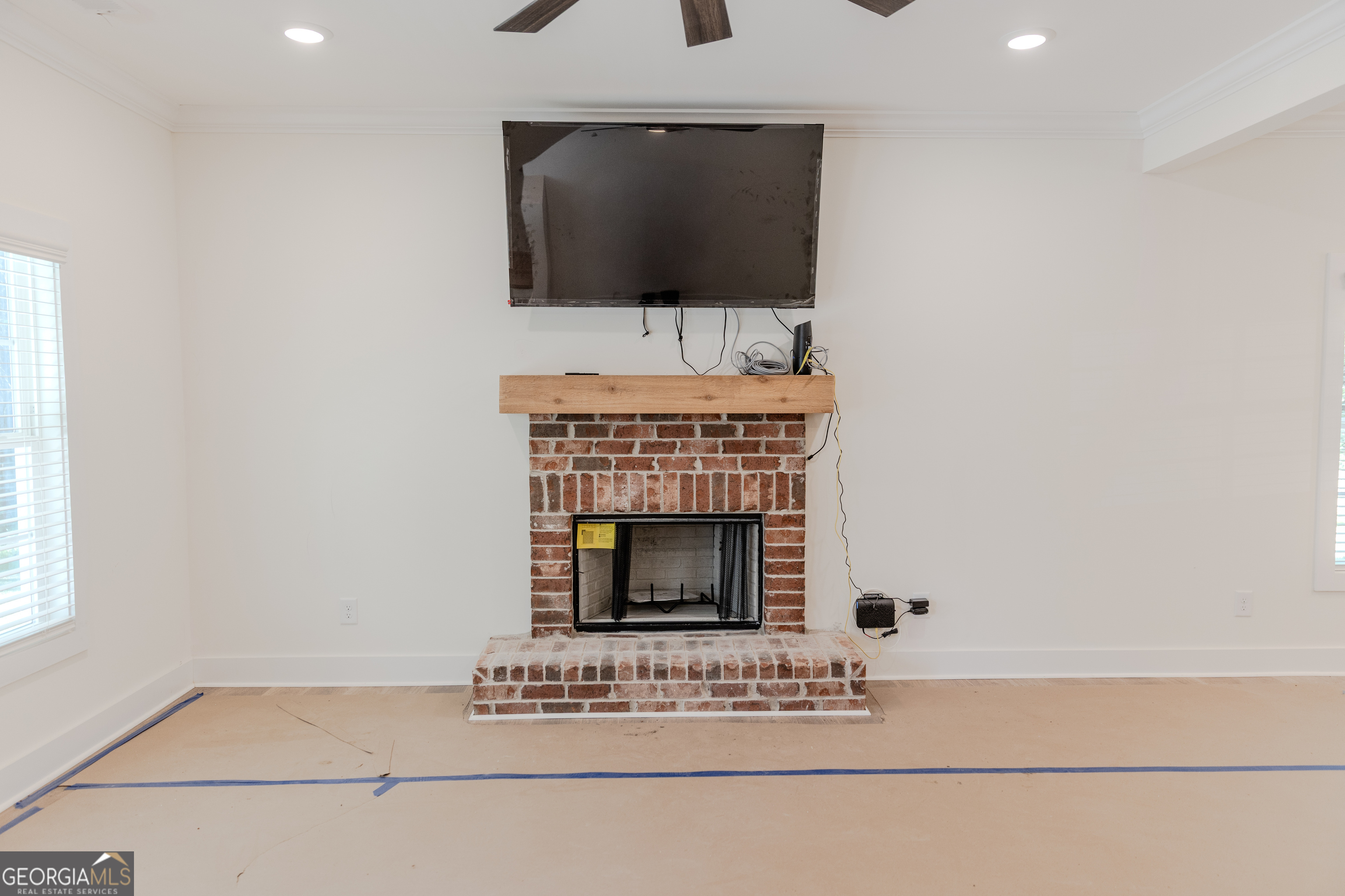 632 Campbell Road Covington, GA 30014 - Photo 28 of 60 a view of fireplace with a flat screen tv