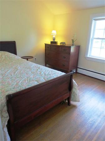 36 Charlesdale Road Medfield, MA 02052 - Photo 11 of 17 a bed sitting in a bedroom next to a window