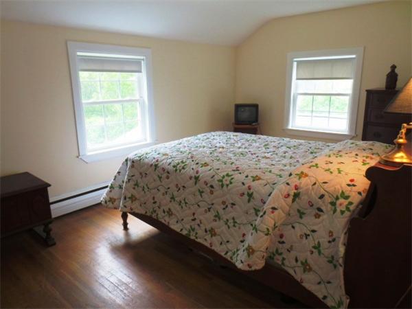 36 Charlesdale Road Medfield, MA 02052 - Photo 14 of 17 a bedroom with a bed and wooden floor