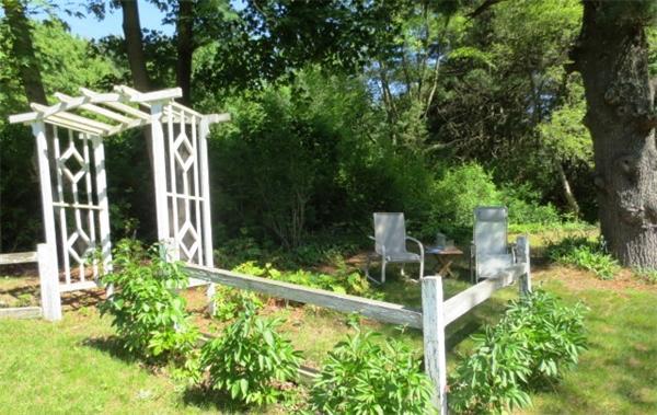 36 Charlesdale Road Medfield, MA 02052 - Photo 15 of 17 a patio with table and chairs and potted plants