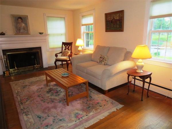 36 Charlesdale Road Medfield, MA 02052 - Photo 2 of 17 a living room with furniture and a fireplace