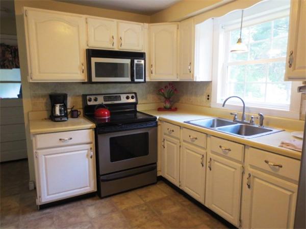 36 Charlesdale Road Medfield, MA 02052 - Photo 3 of 17 a kitchen with stainless steel appliances granite countertop white cabinets a sink and a window
