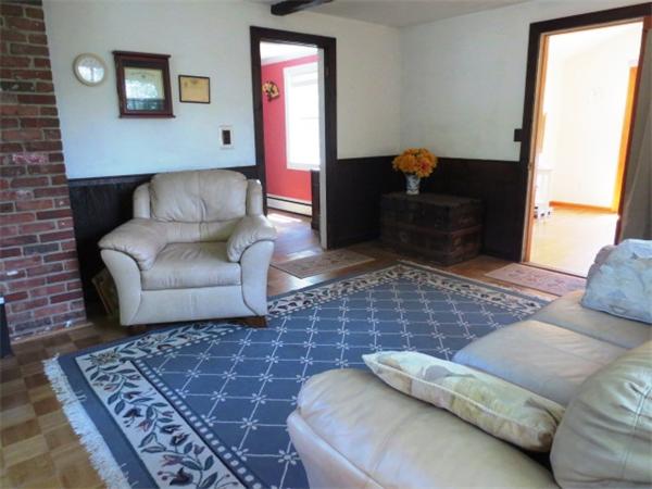 36 Charlesdale Road Medfield, MA 02052 - Photo 7 of 17 a living room with a couch and a rug
