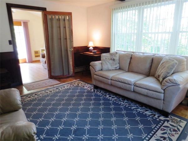 36 Charlesdale Road Medfield, MA 02052 - Photo 8 of 17 a living room with a couch and a rug