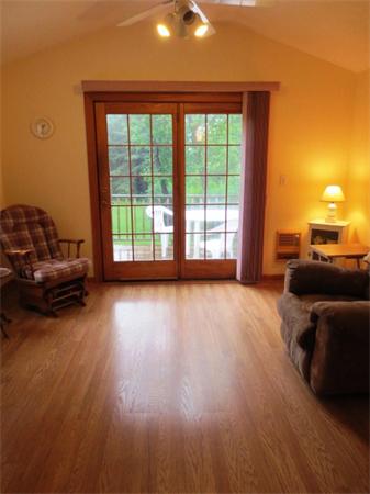36 Charlesdale Road Medfield, MA 02052 - Photo 9 of 17 a view of a livingroom with furniture wooden floor and a floor to ceiling window