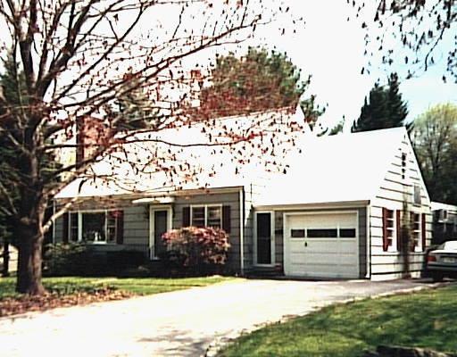 68 New Street Ridgefield, CT 06877 - Photo 1 of 1 a front view of a house with a yard and garage