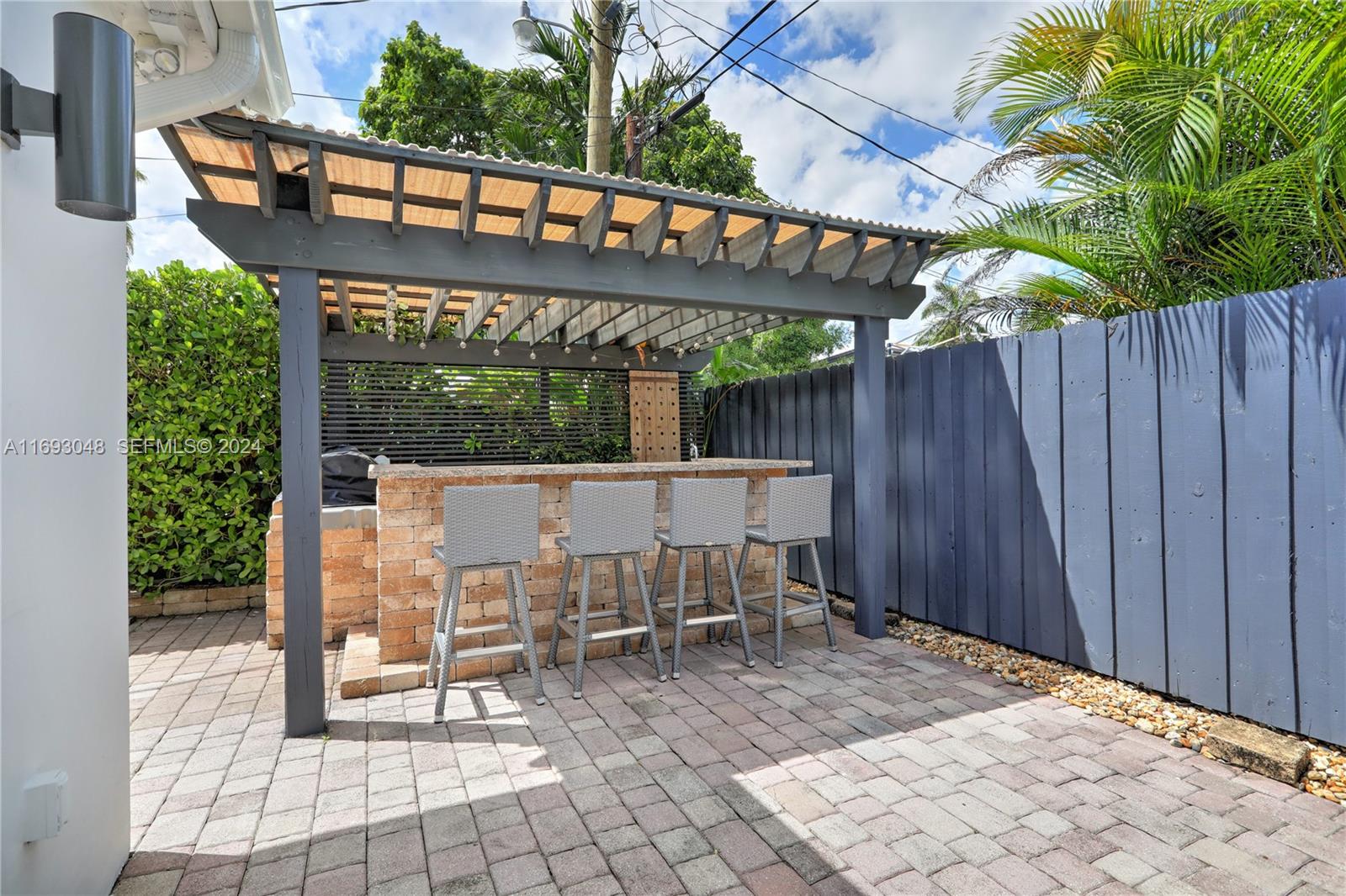 9611 Southwest 59th Terrace Miami, FL 33173 - Photo 24 of 32 a view of a patio with a table and chairs