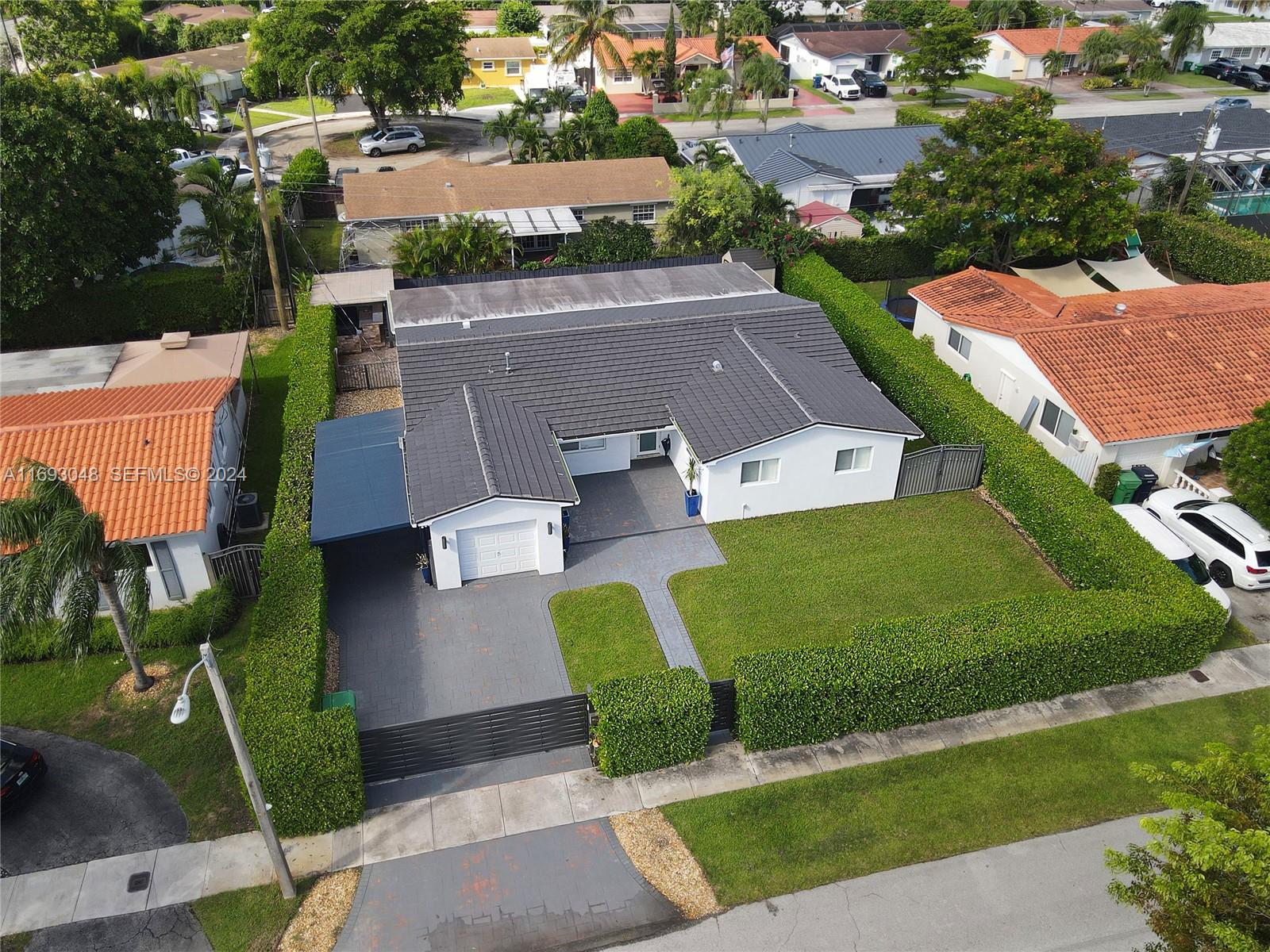 9611 Southwest 59th Terrace Miami, FL 33173 - Photo 27 of 32 an aerial view of a house with garden space and street view