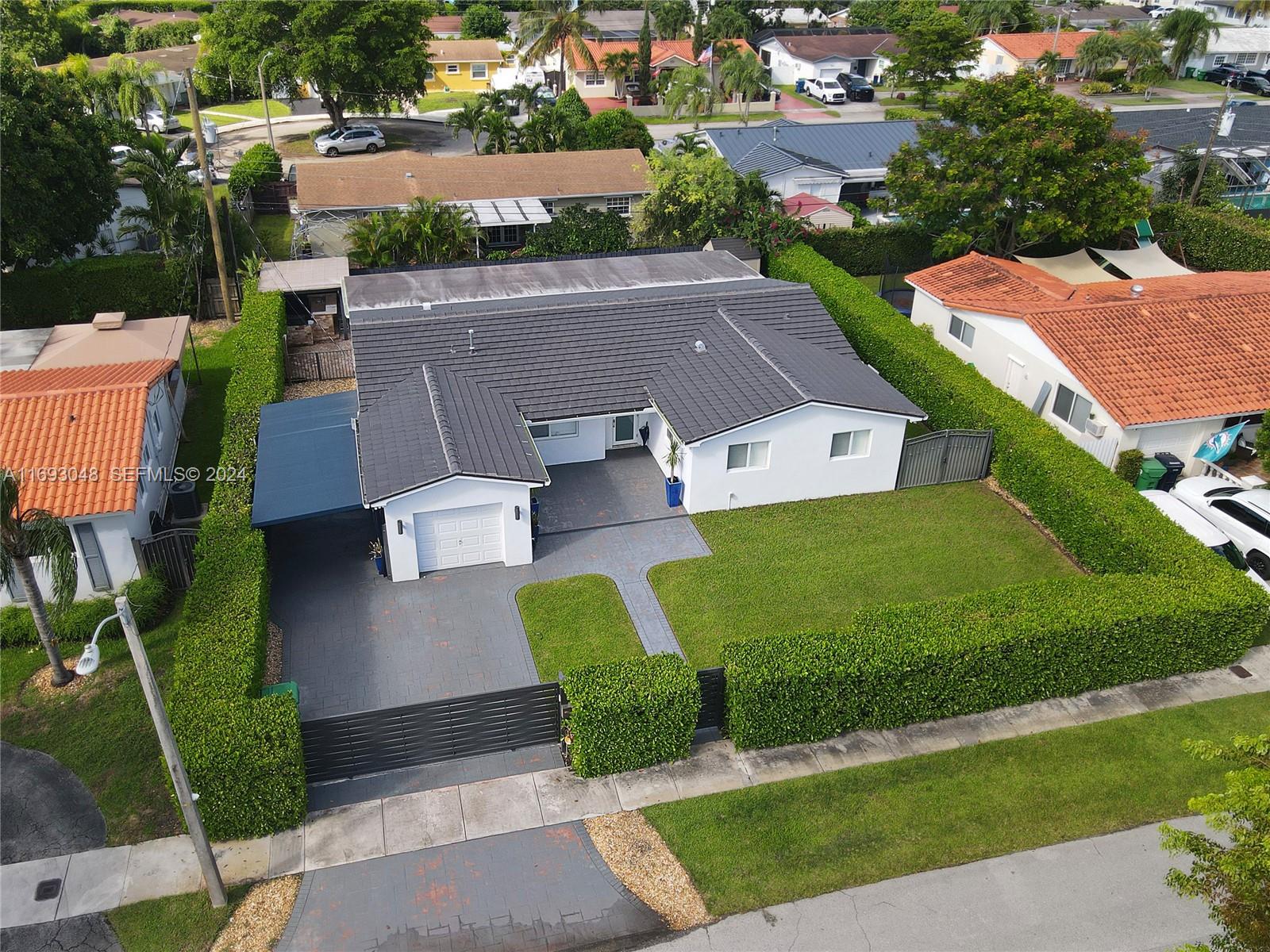 9611 Southwest 59th Terrace Miami, FL 33173 - Photo 28 of 32 an aerial view of a house with garden space and street view