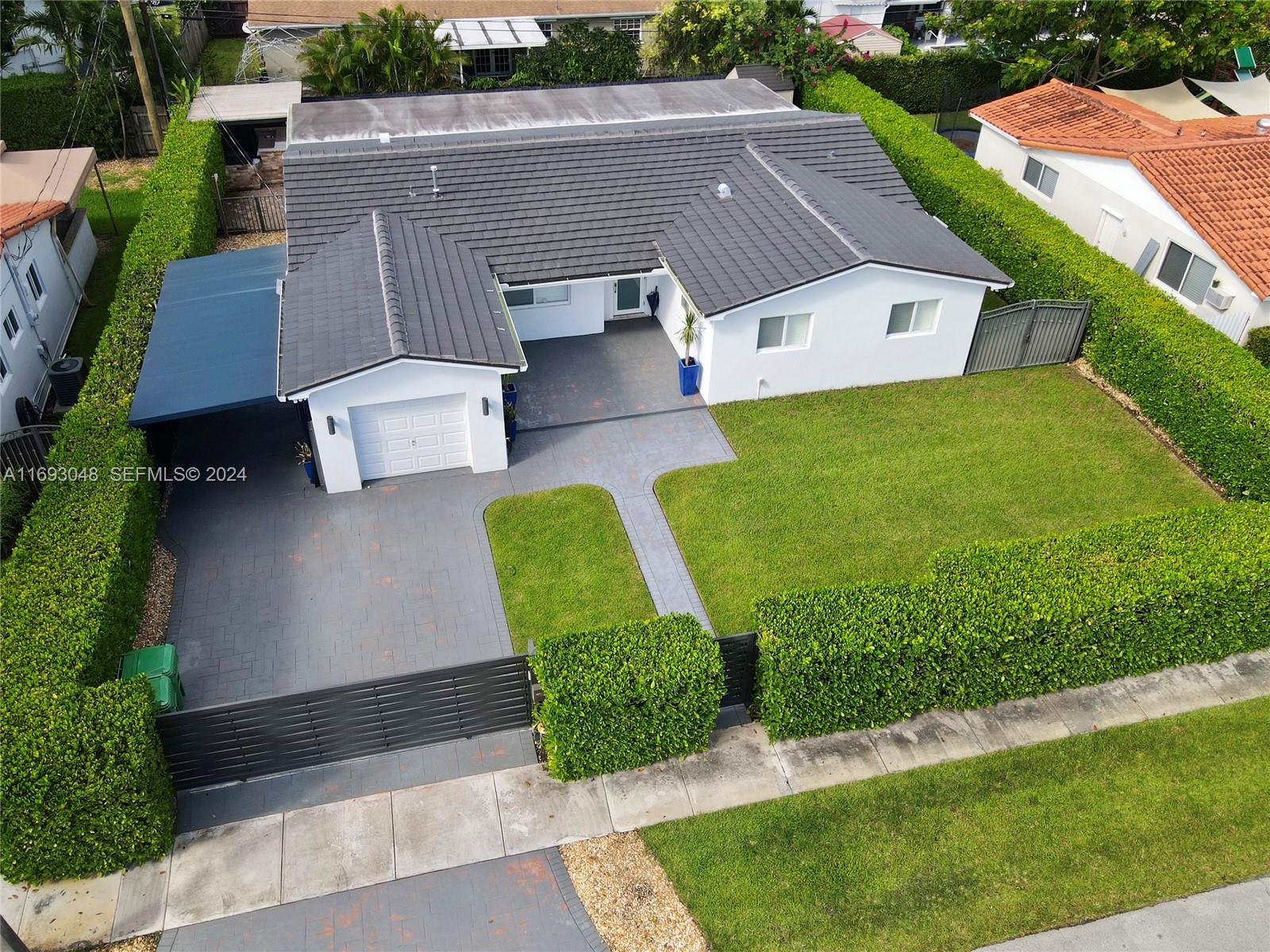 9611 Southwest 59th Terrace Miami, FL 33173 - Photo 29 of 32 an aerial view of a house with garden space and street view