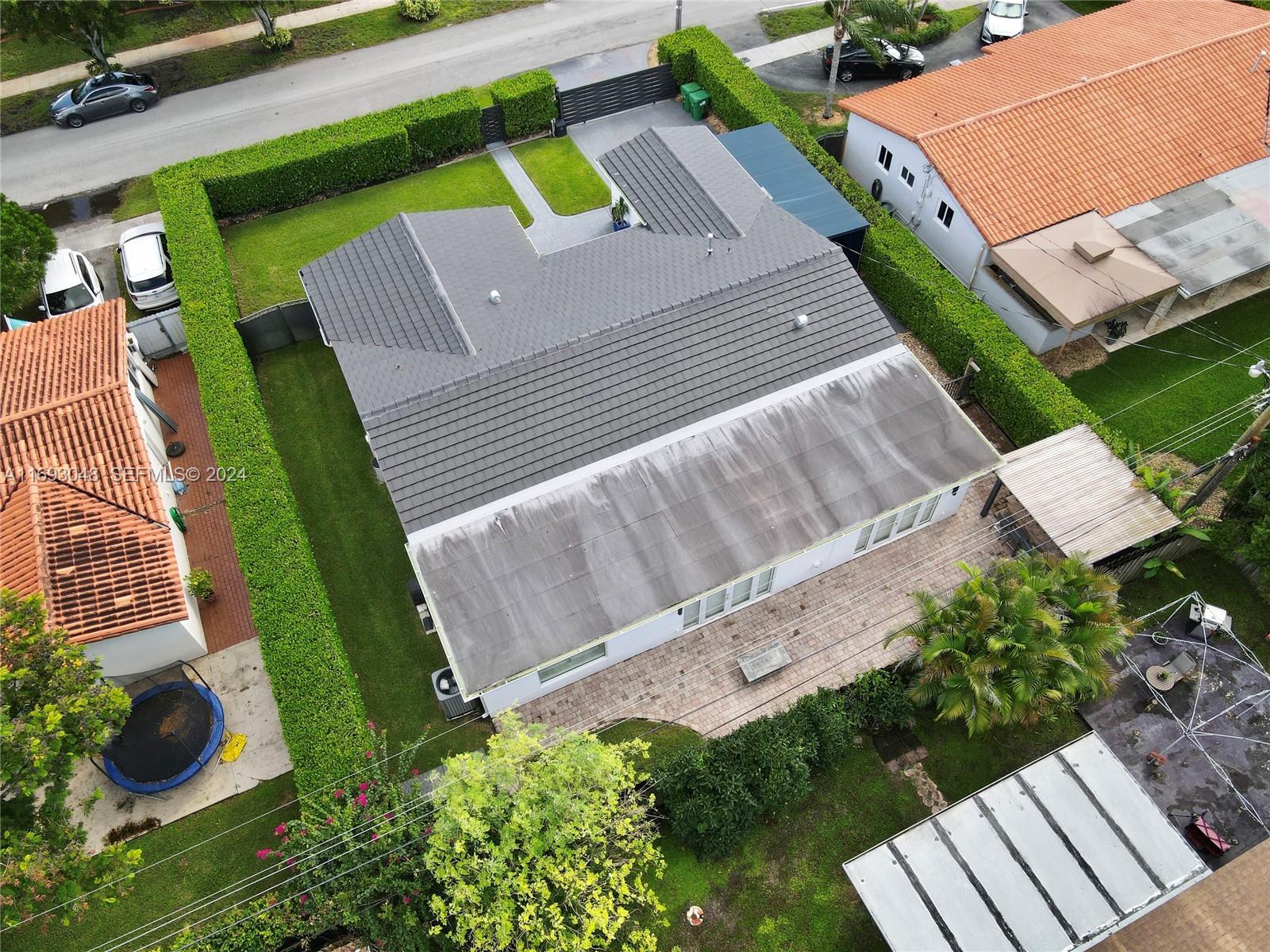 9611 Southwest 59th Terrace Miami, FL 33173 - Photo 30 of 32 an aerial view of a house with garden space and street view