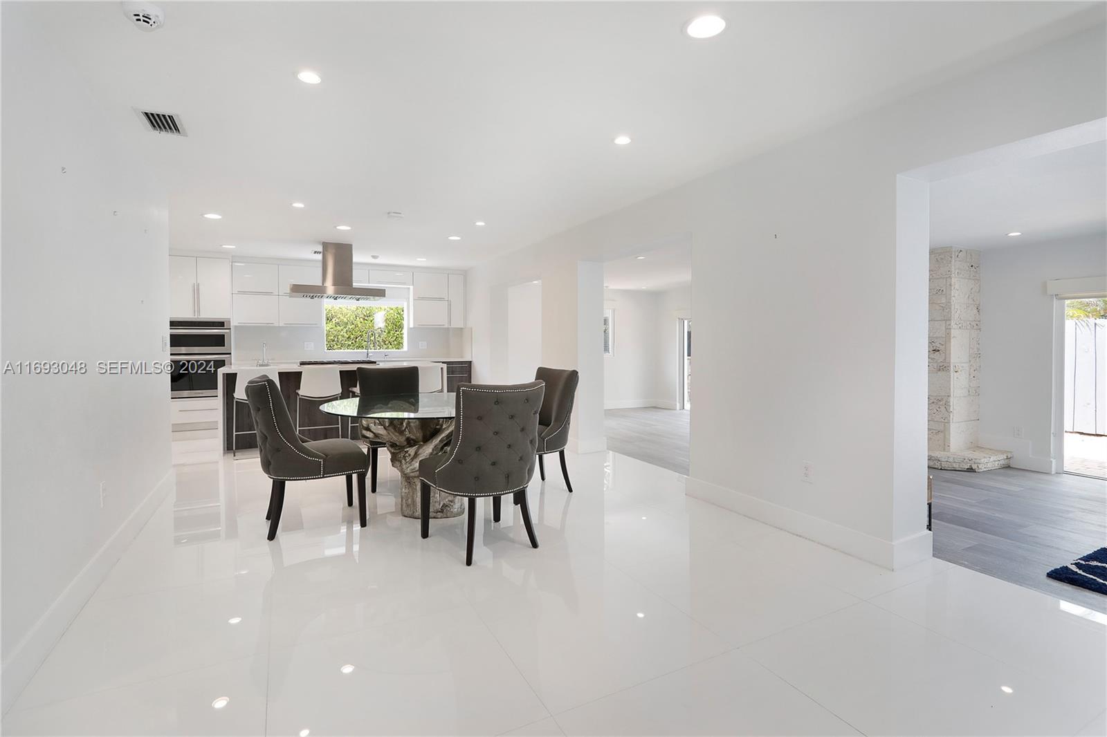 9611 Southwest 59th Terrace Miami, FL 33173 - Photo 6 of 32 a dining room with furniture and a view of kitchen